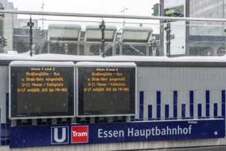 Essen main station, display board informs about cancelled local transport connections, partly full