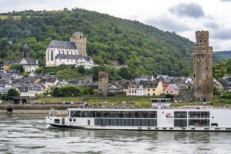 River cruise ship Viking VE on the Rhine in the Upper Middle Rhine Valley, backdrop of the town of