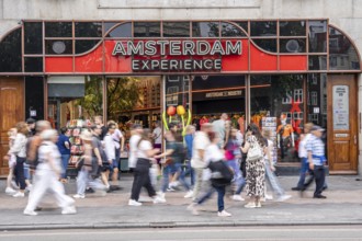 Souvenir shop on Damrak shopping street, many tourists, visitors, Amsterdam, Netherlands