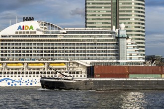 Cruise ship Aida Prima at the Cruise Terminal of Rotterdam, Kop van Zuid, high-rise buildings at