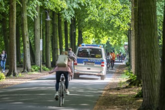 Police patrol on the Promenade cycle path, a tree-lined, car-free, approximately 4.5 km long ring