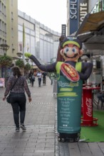 Advertising, figure, for a vegan restaurant, city centre, pedestrian zone, Münzstraße, Duisburg,