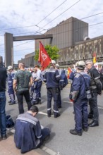 Steelworkers at a demonstration in front of the headquarters of ThyssenKrupp Steel Europe in