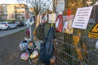 Gift fence with donations for the homeless and needy, food, hygiene articles, clothing, in Essen