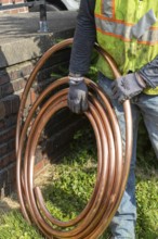 Detroit, Michigan, Workers replace old lead water service lines with copper pipes. Lead is harmful