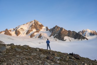 High alpine mountain landscape at sunset, Glacier du Tour, mountaineer in front of glacier and