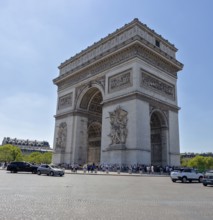 The Arc de Triomphe with clear view and blue sky, cars in the foreground, Paris