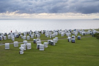 Beach chairs on the green beach, Dramatic sky over the North Sea, View from above, Norddeich, East