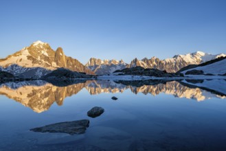 Evening mood, mountain landscape at sunset, alpenglow, water reflection in Lac Blanc, mountain