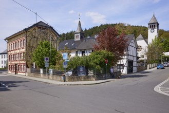 Crossroads with half-timbered houses and Church of the Redeemer in Adenau, Eifel, Ahrweiler