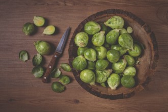 Fresh Brussels sprouts, raw, top view, on a wooden table, no people