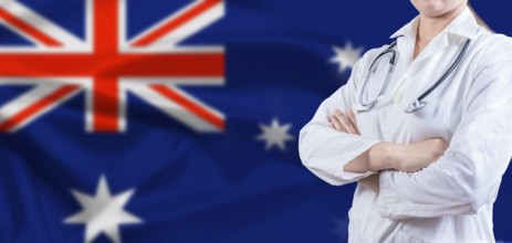 Doctor with crossed arms on Australian flag. Australian Health and Care concept. Female doctor on