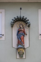 Figure of a saint on a house, Iphofen, Lower Franconia, Bavaria, Germany, Europe