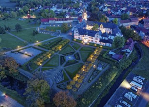 Ehrenstein Castle, a well-preserved Renaissance castle, with castle garden, illuminated at dusk.