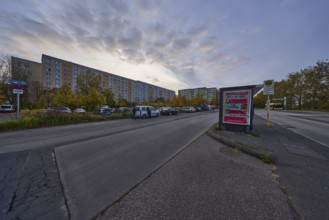 Blocks of flats and bus stop Michelangelostraße at sunset, district Prenzlauer Berg, Berlin,