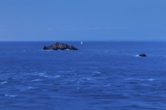 Evening view from the Pointe du Grouin with a view of the Phare de la Pierre-de-Herpin and striking