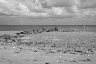 Stone jetty on the coast, Dark clouds over the North Sea, Wyk, Föhr, North Sea island, North