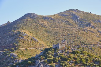 Historic ruin on Green Mountain with dense vegetation in the background, Mani Peninsula,