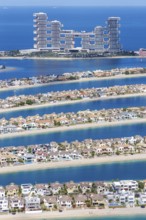 The Palm Jumeirah with Atlantis The Royal Hotel artificial island from above in Dubai, United Arab