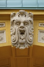 Grotesque above the left entrance portal of the Luitpold Primary School, built in 1901 in Art