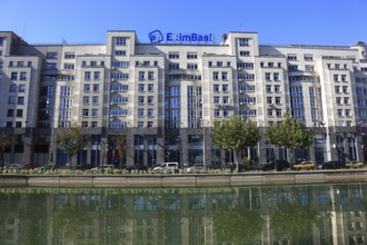 Apartment blocks and office buildings, bank building on the Dambovita River, Bucharest, Romania,