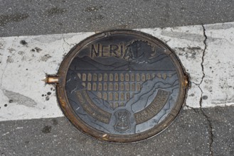 Artistically designed manhole cover on a street, manhole cover, Nerja, Province of Málaga, Malaga,