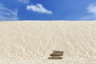 Empty dune, shifting dune, white fine sand, spring clouds, minimalist landscape, symbolic image,