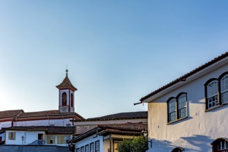 Church tower rising among old colonial houses in the city of Diamantina in Minas Gerais,