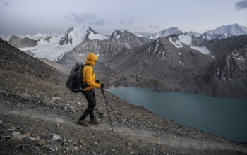 Mountaineer at Ala Köl mountain lake, in the Tien Shan Mountains, near Altyn Arashan, Kyrgyzstan,