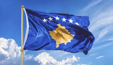 Flags, the national flag of Kosovo flutters in the wind