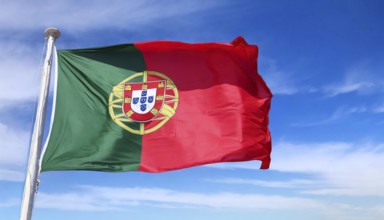 Flags, the national flag of Portugal flutters in the wind