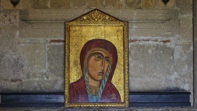 Icon of the Mother of God, close-up of a religious icon, Mary with baby Jesus, on a golden