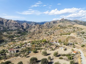 Mountains and Olive groves around Ghost Town from a drone, Pentedattilo Village, Calabria, Italy,