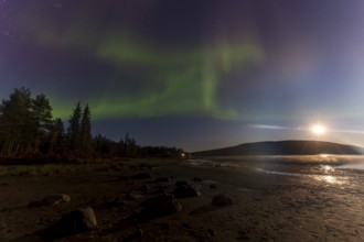 Northern lights, (Aurora borealis) at a lake near Kiruna, September 2024, Lapland, Sweden, Europe