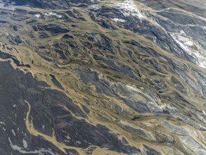 Aerial view, glaicial streams flow across Mælifellssandur, black sand desert, Icelandic highlands,