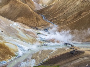 Steaming hot springs and colourful rhyolite mountains, hiking path, Hveradalir geothermal area,