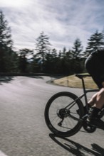 Road bike rider in spring between Lechtal and Tannheimer Tal in front of picturesque scenery of the