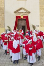 Confraternity of penitents gathering outside San Leonardo church, Enna, Siclly, Italy, Europe