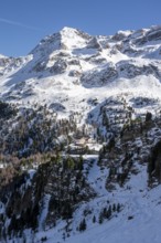 Zufallhütte mountain hut, view of the Martell Valley, snow-covered mountain landscape in winter,