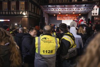 Large crowd looking at an illuminated stage at a night event, carnival, Calw, Black Forest, Calw