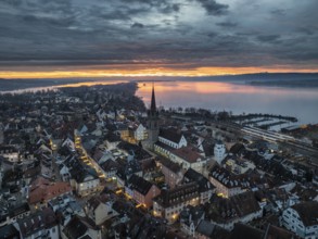 Aerial view of an atmospheric sunrise over the town of Radolfzell on Lake Constance with the