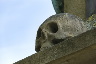 Skull, stone sculpture on the crucifix on the east side of the cathedral, Überlingen,