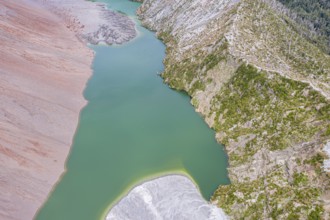 Dead trees, crater rim of Chaiten volcano, colored rock, small lake, aerial view, Park Pumalin,