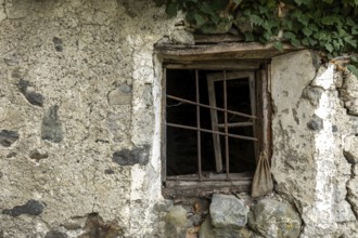 Dilapidated window of an old house in the mountain village of Bordei, Centovalli, Canton Ticino,