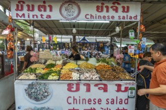 Buffet with Chinese salad at the night market in Luang Prabang, Laos, Asia