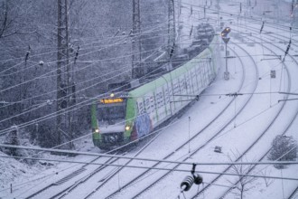 Winter weather, heavy snowfall, railway tracks in front of Essen main station, S-Bahn train, North