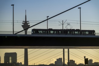 Tram on the Oberkassler Rhine Bridge, Rhine Tower, behind the Rheinknie Bridge, Düsseldorf, North