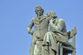 Brothers Grimm national monument, standing Jacob and sitting on the chair Wilhelm, brothers, bronze