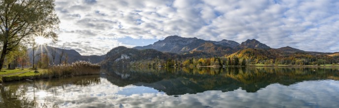 Autumnal mountain landscape with mountain peaks Herzogstand and Heimgarten, reflection in Lake