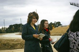 British geography students with notepads on a field trip to the sea salt pans in Cotusal, Tunisia,